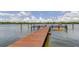 A long residential dock equipped with a kayak launch in a serene setting at 19701 Gulf Blvd # 328, Indian Shores, FL 33785