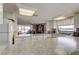 Spacious kitchen with granite countertops and view of the living room at 19701 Gulf Blvd # 328, Indian Shores, FL 33785