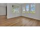 Bright bedroom features three windows, ample natural light and hardwood flooring at 2436 Jacobs St, Port Charlotte, FL 33953