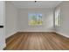 Inviting bedroom with wood flooring and ample natural light from large windows at 2436 Jacobs St, Port Charlotte, FL 33953