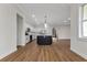 Open kitchen and dining area showcasing modern cabinetry, an island, and hardwood flooring at 2436 Jacobs St, Port Charlotte, FL 33953