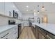 Well-appointed kitchen with quartz countertops, stainless steel appliances, and custom cabinetry at 2436 Jacobs St, Port Charlotte, FL 33953