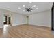 Open living area featuring hardwood flooring, recessed lighting, and neutral decor at 2436 Jacobs St, Port Charlotte, FL 33953