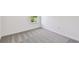 Neutral bedroom featuring one window with bright, natural light and gray carpet at 36424 Sespe Creek Ct, Zephyrhills, FL 33540