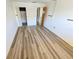 Empty bedroom featuring durable flooring, neutral paint, and a door leading to a closet at 6075 Shore S Blvd # 605, Gulfport, FL 33707