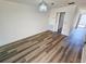Bright living room featuring modern flooring and a unique light fixture for a cozy atmosphere at 6075 Shore S Blvd # 605, Gulfport, FL 33707