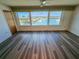 Bright living space with waterfront views from a large window and new flooring at 6075 Shore S Blvd # 605, Gulfport, FL 33707