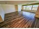 Well-lit living room with scenic city views through large windows and modern flooring at 6075 Shore S Blvd # 605, Gulfport, FL 33707