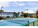 Well-maintained tennis court provides an active outdoor amenity for residents to enjoy a friendly match at 6075 Shore S Blvd # 605, Gulfport, FL 33707