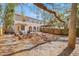 Large backyard with a wooden deck, seating, mature trees, and a privacy fence, perfect for outdoor living at 6211 S Macdill Ave # 1, Tampa, FL 33611