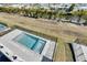 Aerial view of a backyard featuring a pool and view of waterways at 6538 Simone Shores Cir, Apollo Beach, FL 33572