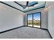 Bright bedroom featuring a large sliding glass door, ceiling fan and recessed lighting at 6538 Simone Shores Cir, Apollo Beach, FL 33572