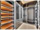 Luxurious walk-in closet offers shelving, lighting, and drawer storage at 6538 Simone Shores Cir, Apollo Beach, FL 33572