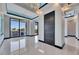 Bright dining area with elegant lighting and access to an outdoor kitchen and grill at 6538 Simone Shores Cir, Apollo Beach, FL 33572