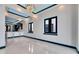 Open dining area with elegant lighting adjacent to a modern kitchen with bar seating at 6538 Simone Shores Cir, Apollo Beach, FL 33572