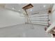 Spacious garage featuring epoxy flooring and garage door at 6538 Simone Shores Cir, Apollo Beach, FL 33572
