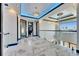 Second-story hallway with glass railing and recessed ceiling lights at 6538 Simone Shores Cir, Apollo Beach, FL 33572