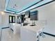 Open kitchen features a center island with bar seating and modern lighting fixtures at 6538 Simone Shores Cir, Apollo Beach, FL 33572