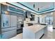 Stainless steel appliances and modern cabinetry highlight this luxury kitchen space at 6538 Simone Shores Cir, Apollo Beach, FL 33572