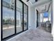 A spacious patio offering a serene view of the lush outdoor landscape at 6538 Simone Shores Cir, Apollo Beach, FL 33572