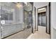 The shower is enclosed in glass and adjacent to a walk-in closet for convenience at 6538 Simone Shores Cir, Apollo Beach, FL 33572