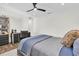 Bedroom featuring a ceiling fan, hardwood floors, and modern furniture at 1401 75Th Ne Cir, St Petersburg, FL 33702