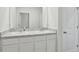 Bathroom featuring a double vanity with white cabinets, offering ample space and storage at 2604 Knight Island Dr, Brandon, FL 33511
