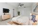 Modern bedroom featuring a bed, dresser, TV, and stylish decor, creating a cozy and inviting space at 2604 Knight Island Dr, Brandon, FL 33511