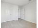 An empty bedroom with a double door closet features laminate flooring at 2604 Knight Island Dr, Brandon, FL 33511