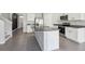 Kitchen with stainless steel appliances, granite countertops, and white cabinets at 2604 Knight Island Dr, Brandon, FL 33511