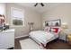 Inviting bedroom with a plush white rug, soft lighting, and a charming decor at 5292 Kernwood Ct, Palm Harbor, FL 34685