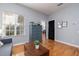Bright bedroom with natural light, blue dresser, and wood floors exudes comfort and style at 5292 Kernwood Ct, Palm Harbor, FL 34685