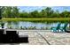 A spacious, brick-paved patio features stylish outdoor furniture, offering a peaceful retreat with picturesque water views at 5749 Cheech Gln, Bradenton, FL 34211