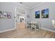 Dining room featuring table with chairs, hardwood floors, and views to the kitchen at 5749 Cheech Gln, Bradenton, FL 34211