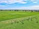 Community golf driving range with players practicing on a sunny day at 5749 Cheech Gln, Bradenton, FL 34211