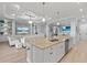 Open-concept kitchen features a large island with granite countertops and a seamless flow to the living area at 5749 Cheech Gln, Bradenton, FL 34211