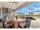 Outdoor kitchen with stainless steel grill, granite countertop, and lake views at 5749 Cheech Gln, Bradenton, FL 34211