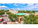 Exterior view of Starbucks Coffee with a green roof, mature trees, outdoor seating, and convenient access in the plaza at 5749 Cheech Gln, Bradenton, FL 34211