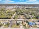 Wide aerial view of a single-Gathering home with mature trees, and expansive land in a rural community at 6706 Sierra Ter, New Port Richey, FL 34652