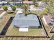 Aerial view of the property highlighting the fenced backyard, landscaping, and proximity to neighboring homes at 6706 Sierra Ter, New Port Richey, FL 34652