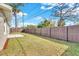 A spacious backyard featuring a well-maintained fence and green grass, perfect for outdoor activities at 6706 Sierra Ter, New Port Richey, FL 34652