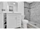 Modern bathroom features stylish tile shower and updated vanity with ample storage at 6706 Sierra Ter, New Port Richey, FL 34652