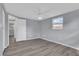 Bedroom with a light gray walls, a window, ceiling fan, and hardwood floors at 6706 Sierra Ter, New Port Richey, FL 34652