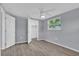 Bright bedroom with a ceiling fan, closet, and large window at 6706 Sierra Ter, New Port Richey, FL 34652