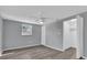 Bedroom featuring neutral walls, a ceiling fan, plank floors, and a walk-in closet at 6706 Sierra Ter, New Port Richey, FL 34652