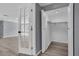 Walk-in closet with ample storage space and modern finishes at 6706 Sierra Ter, New Port Richey, FL 34652