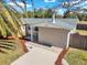 Charming home features a well-maintained exterior with a new roof, landscaping, and a welcoming walkway at 6706 Sierra Ter, New Port Richey, FL 34652