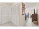 Bright bedroom featuring tile floors, closet doors, and decoratively painted canvases on the wall at 1007 Lake Avoca Dr, Tarpon Springs, FL 34689