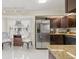 Bright kitchen featuring stainless steel appliances, granite countertops, and stylish cabinetry at 1007 Lake Avoca Dr, Tarpon Springs, FL 34689