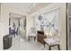 Eat-in kitchen space with plenty of natural light, decorative chairs and view to a formal dining room at 1007 Lake Avoca Dr, Tarpon Springs, FL 34689